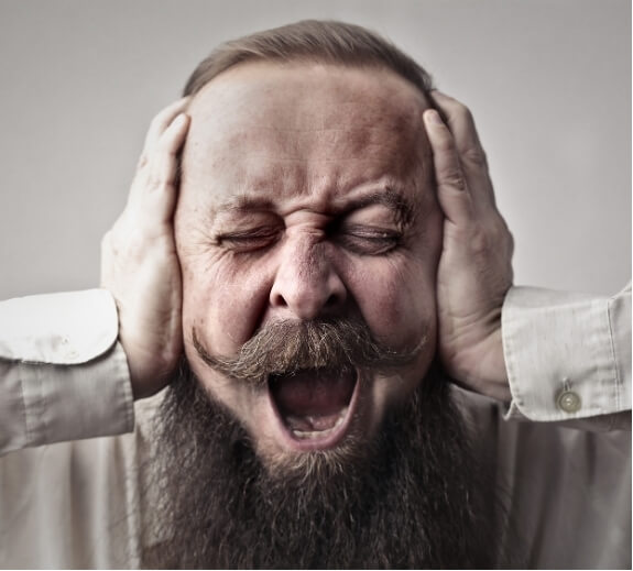 Man experiencing severe headache, representing the need for effective migraine medications.